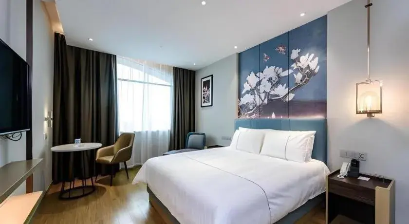 Bed in Magnotel Hotel Dongxing Guomen Port Bed in Magnotel Hotel Dongxing Guomen Port