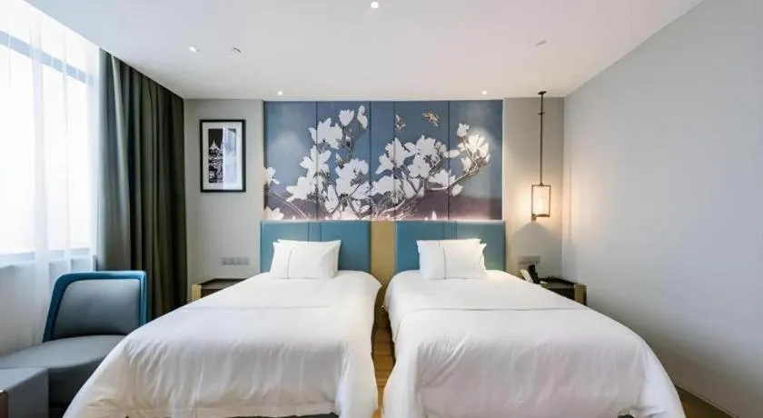 Bed in Magnotel Hotel Dongxing Guomen Port