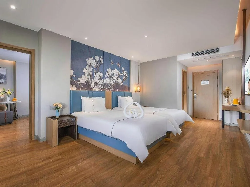 Bed in Magnotel Hotel Dongxing Guomen Port