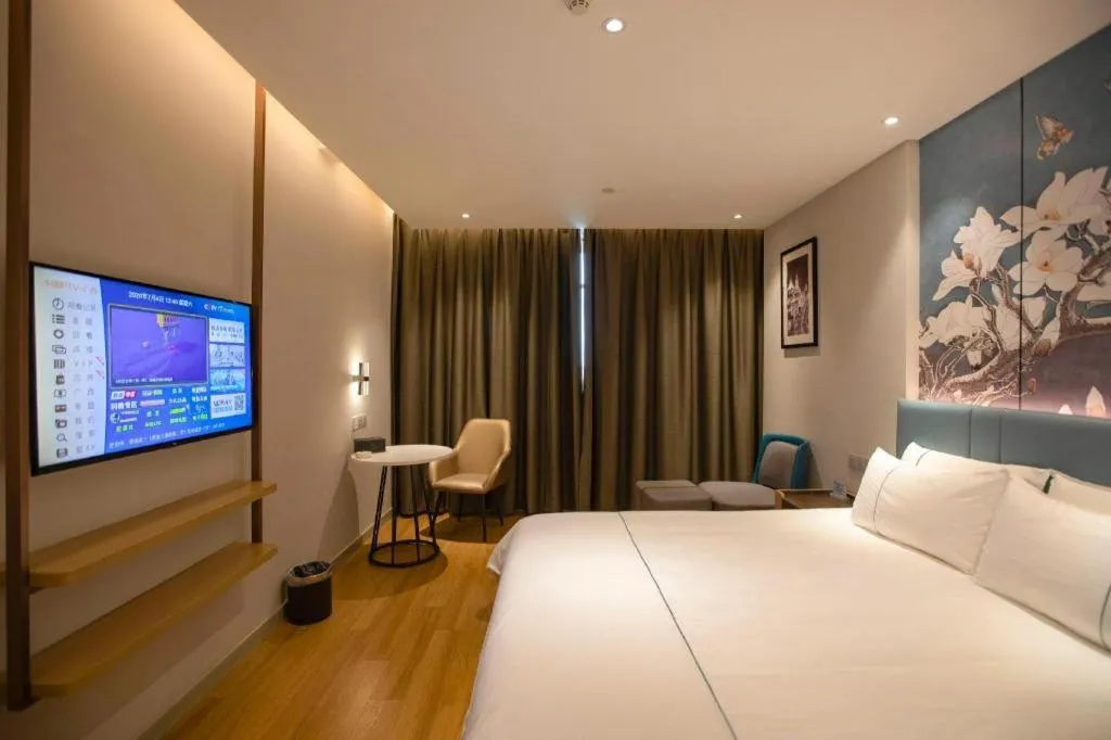 Bed in Magnotel Hotel Dongxing Guomen Port