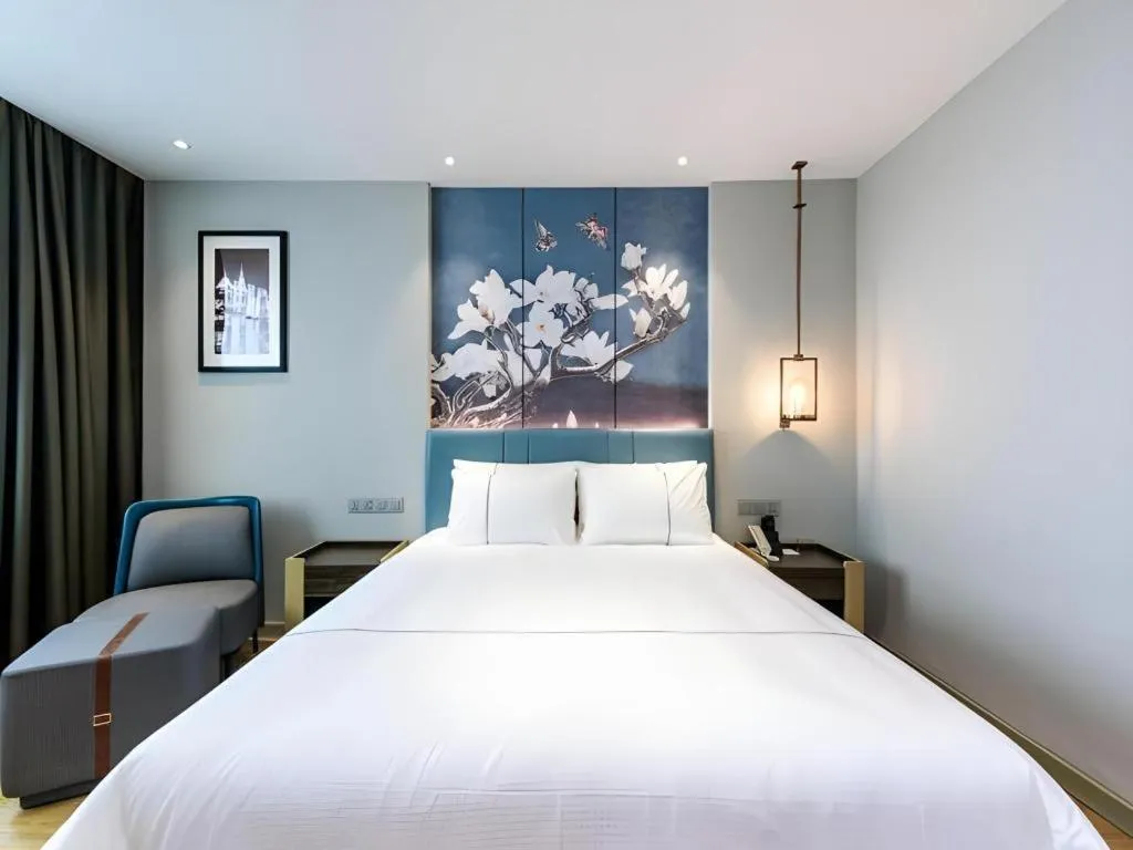Bed in Magnotel Hotel Dongxing Guomen Port