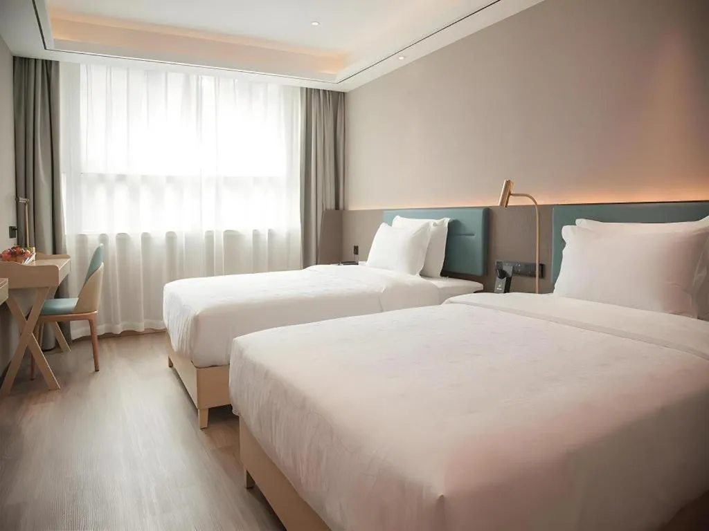 Bed in Zmax Hotel Guangzhou Railway Station