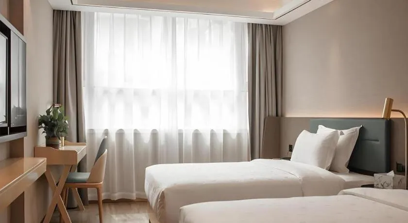 Bed in Zmax Hotel Guangzhou Railway Station