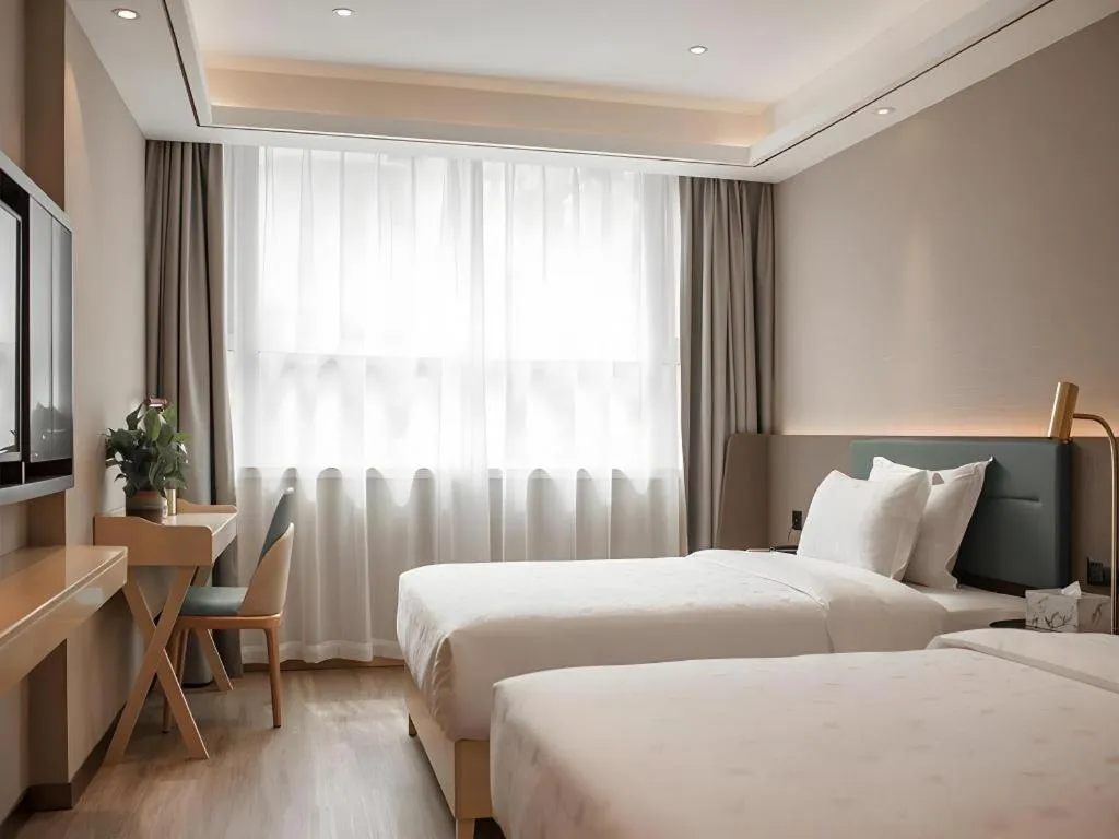 Bed in Zmax Hotel Guangzhou Railway Station