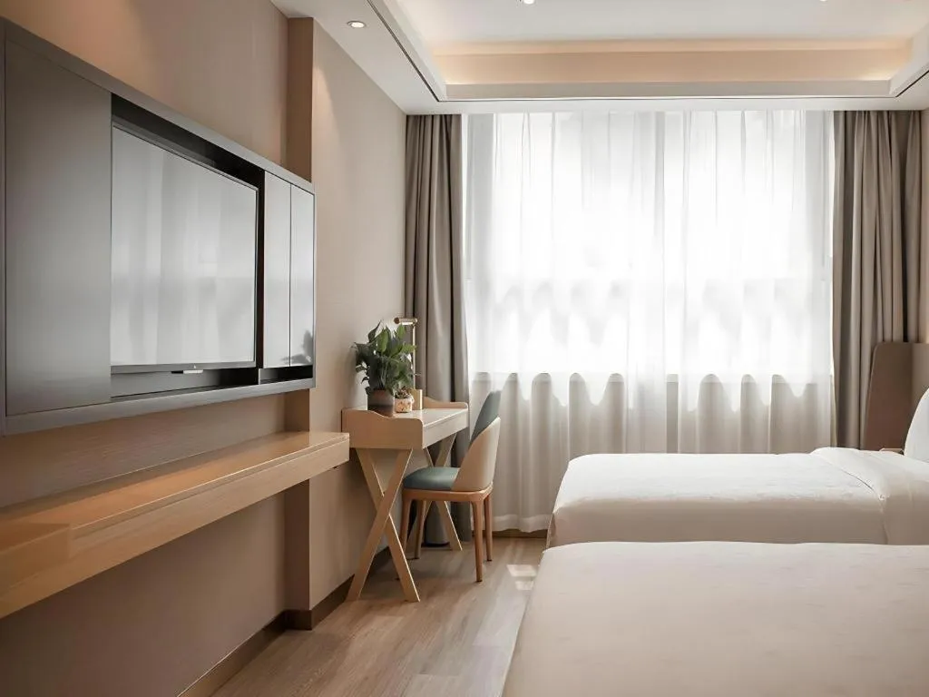 Bed in Zmax Hotel Guangzhou Railway Station