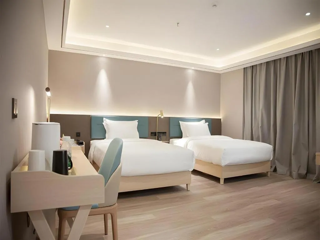 Bed in Zmax Hotel Guangzhou Railway Station