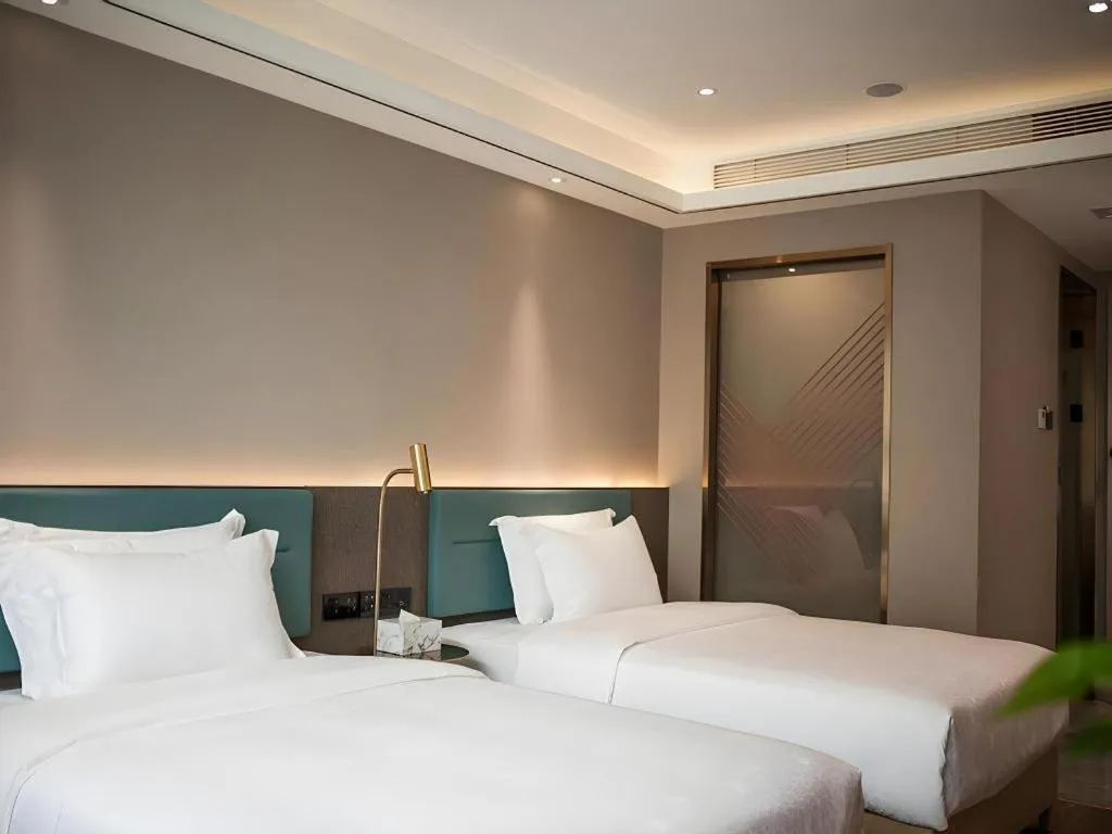 Bed in Zmax Hotel Guangzhou Railway Station