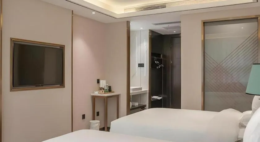 Bed in Zmax Hotel Guangzhou Railway Station