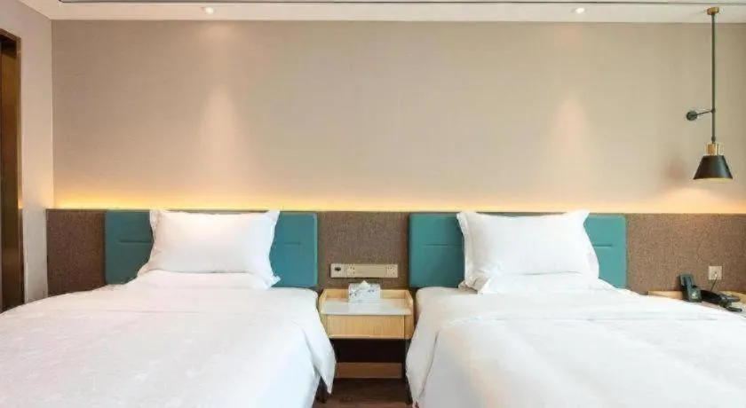 Bed in Zmax Hotel Guangzhou Railway Station