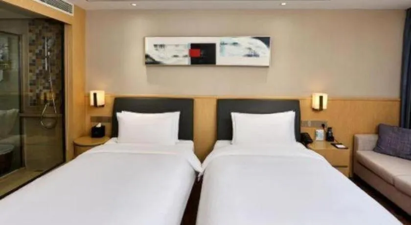 Bed in YUN-RAY Ambassador Hotel