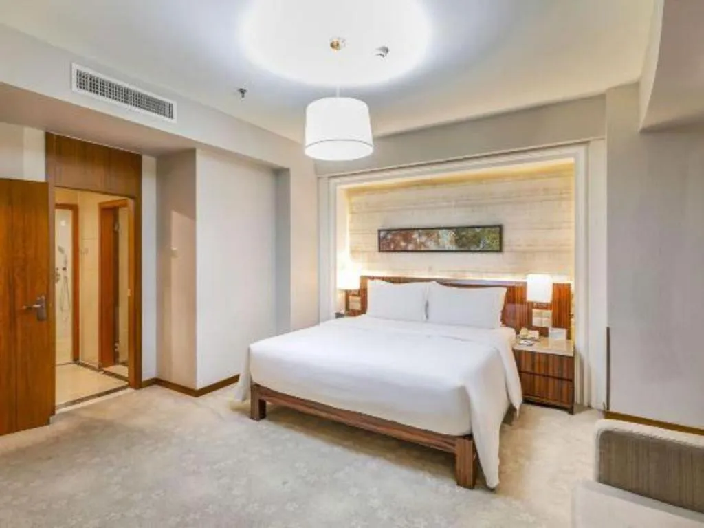 Bed in YUN-RAY Ambassador Hotel