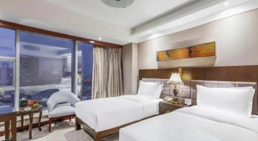 Bed in YUN-RAY Ambassador Hotel