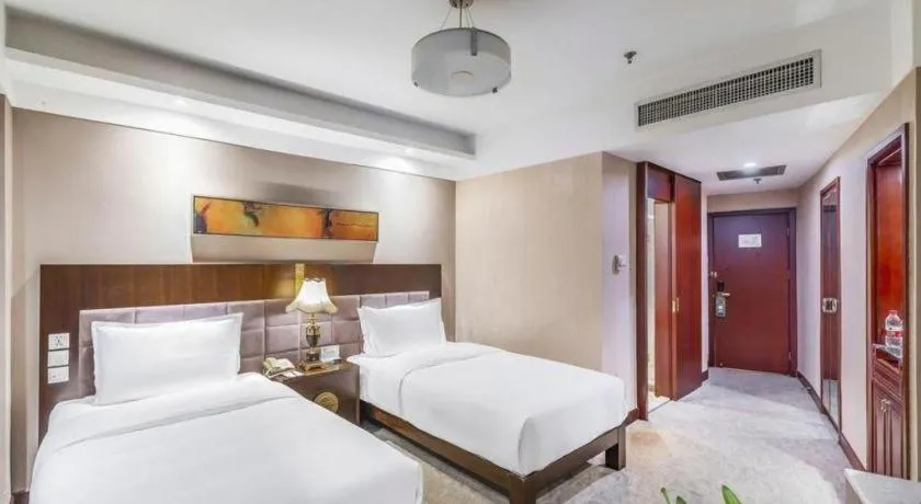 Bed in YUN-RAY Ambassador Hotel