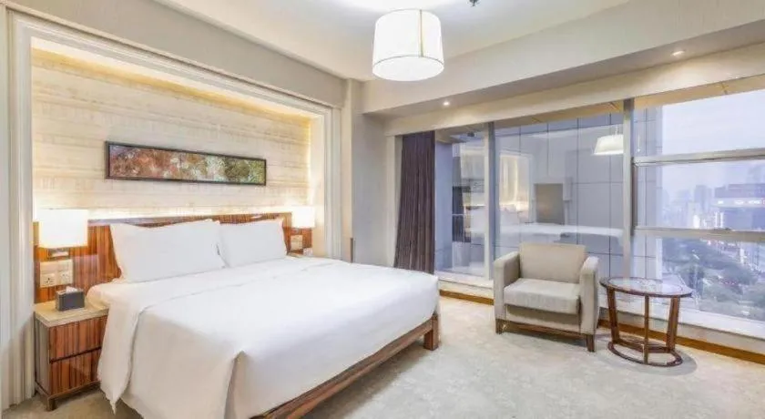 Bed in YUN-RAY Ambassador Hotel