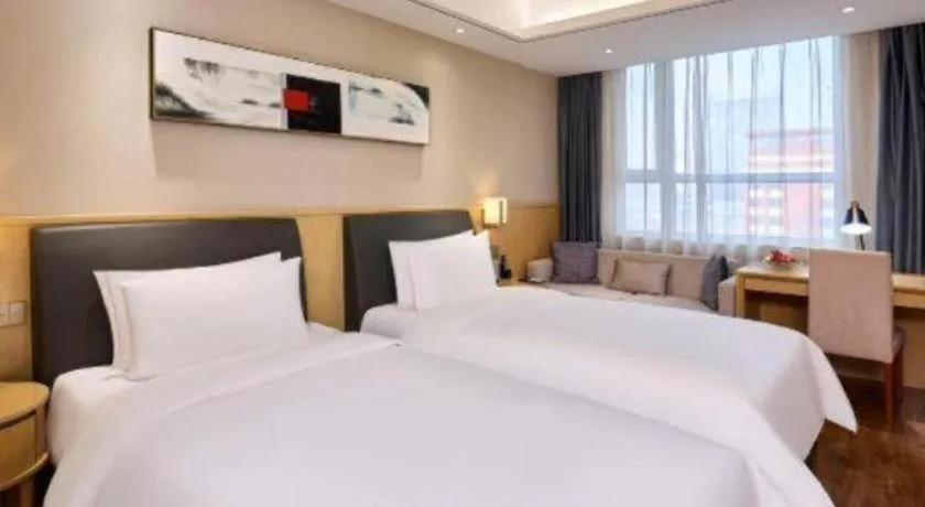 Bed in YUN-RAY Ambassador Hotel