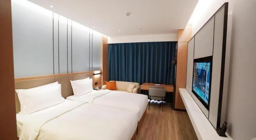 Bed in YUN-RAY Ambassador Hotel