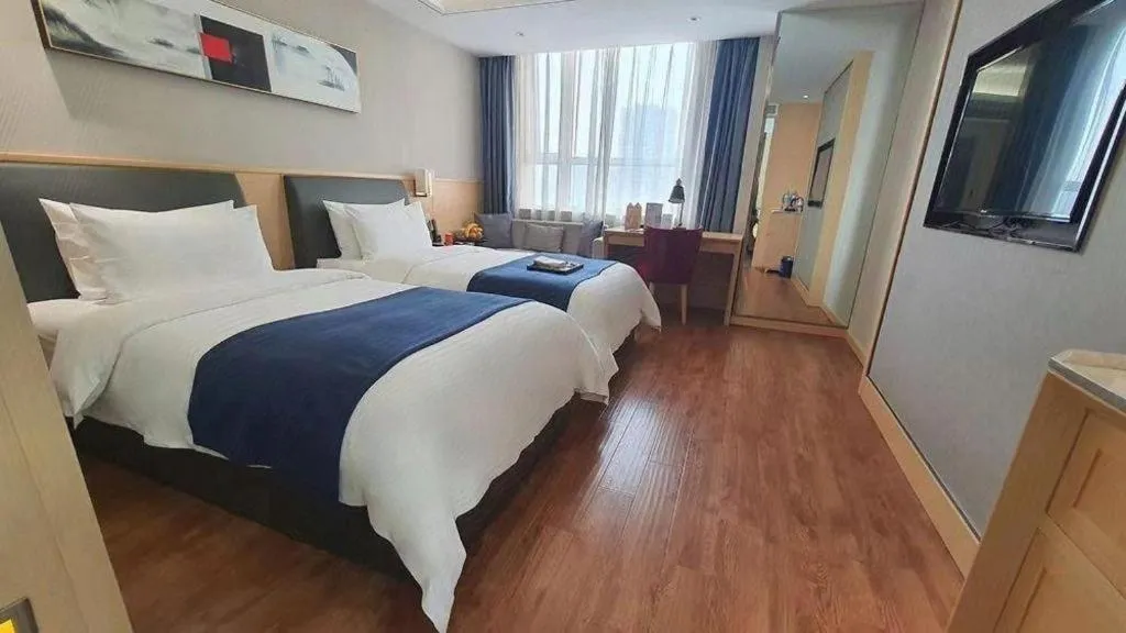 Bed in YUN-RAY Ambassador Hotel