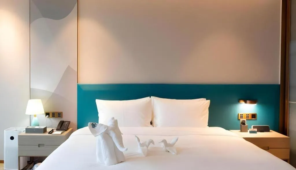 Bed in Zhuhai Hongsanyi Hotel