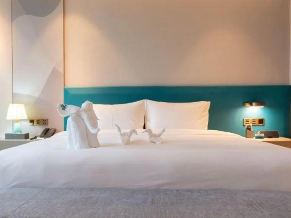 Bed in Zhuhai Hongsanyi Hotel