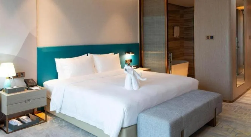 Bed in Zhuhai Hongsanyi Hotel