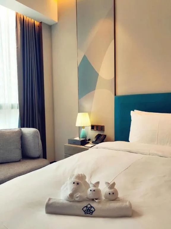 Bed in Zhuhai Hongsanyi Hotel