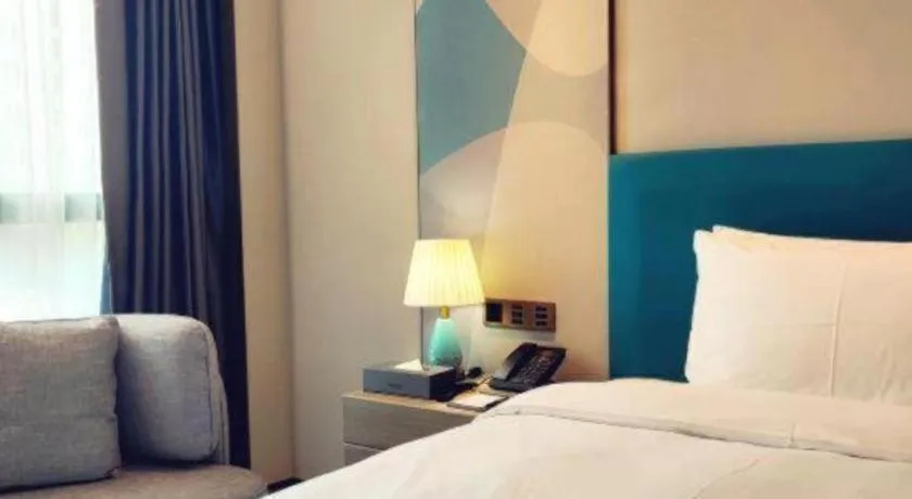 Bed in Zhuhai Hongsanyi Hotel