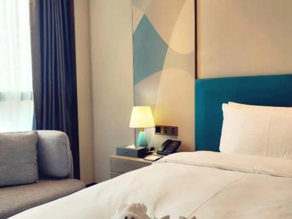 Bed in Zhuhai Hongsanyi Hotel