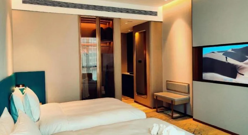 Bed in Zhuhai Hongsanyi Hotel