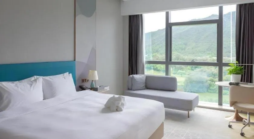 Bed in Zhuhai Hongsanyi Hotel