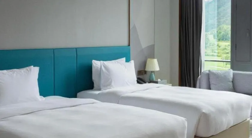 Bed in Zhuhai Hongsanyi Hotel