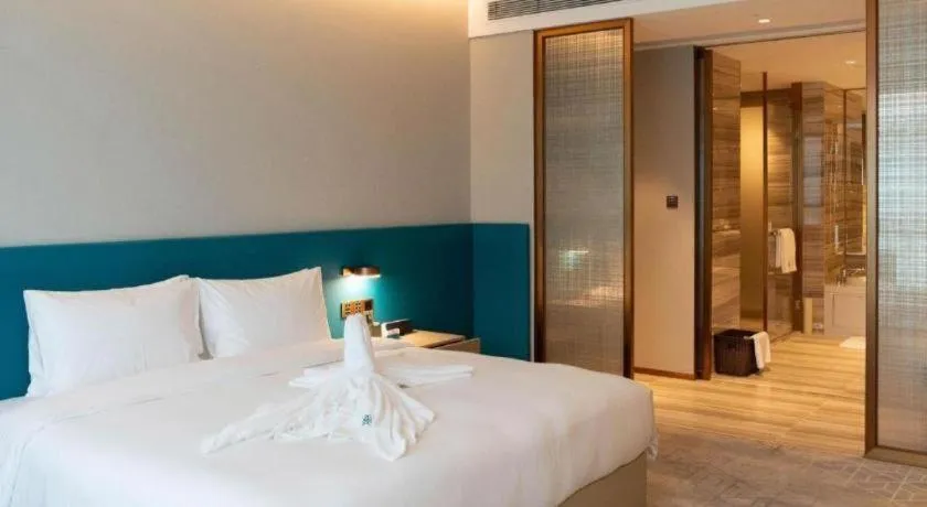 Bed in Zhuhai Hongsanyi Hotel