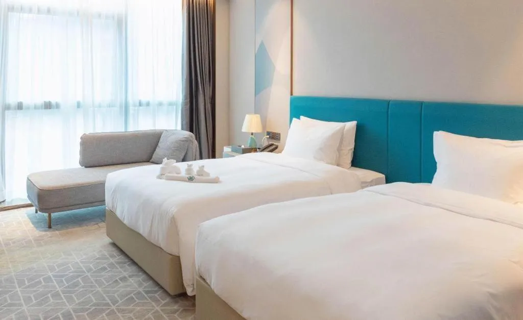 Bed in Zhuhai Hongsanyi Hotel