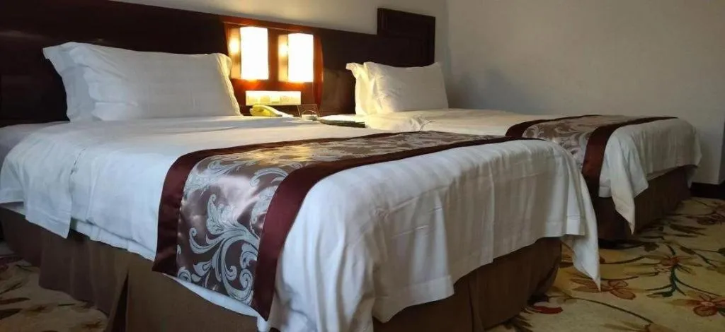 Bed in Hong Ye Hotel