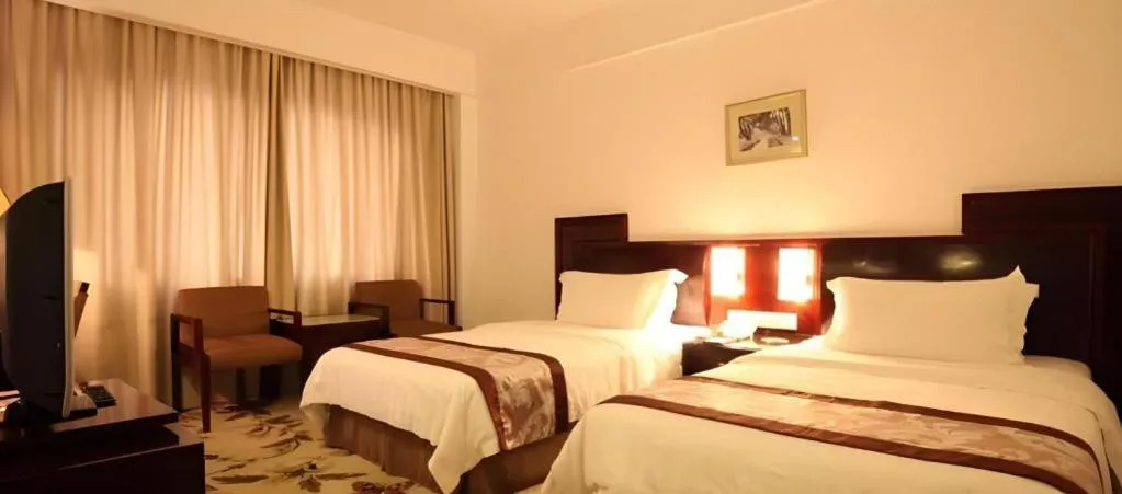 Bed in Hong Ye Hotel