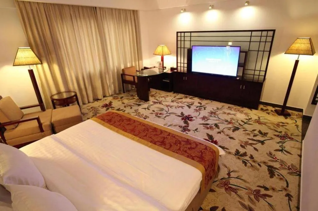 Bed in Hong Ye Hotel