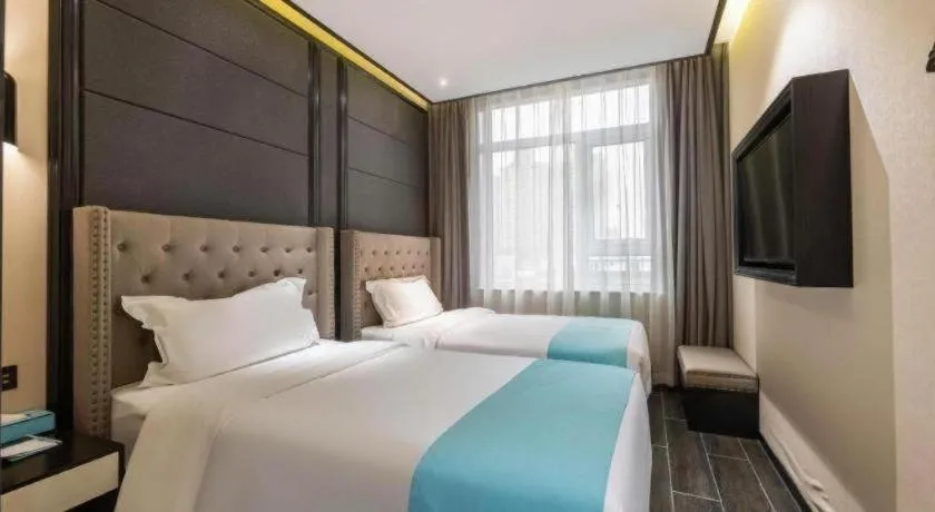 Bed in Xana Hotelle Beijing Fengtai Railway Station Tiantan Hospital