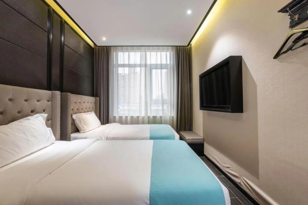 Bed in Xana Hotelle Beijing Fengtai Railway Station Tiantan Hospital