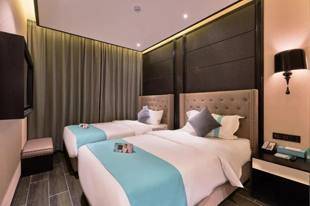 Bed in Xana Hotelle Beijing Fengtai Railway Station Tiantan Hospital