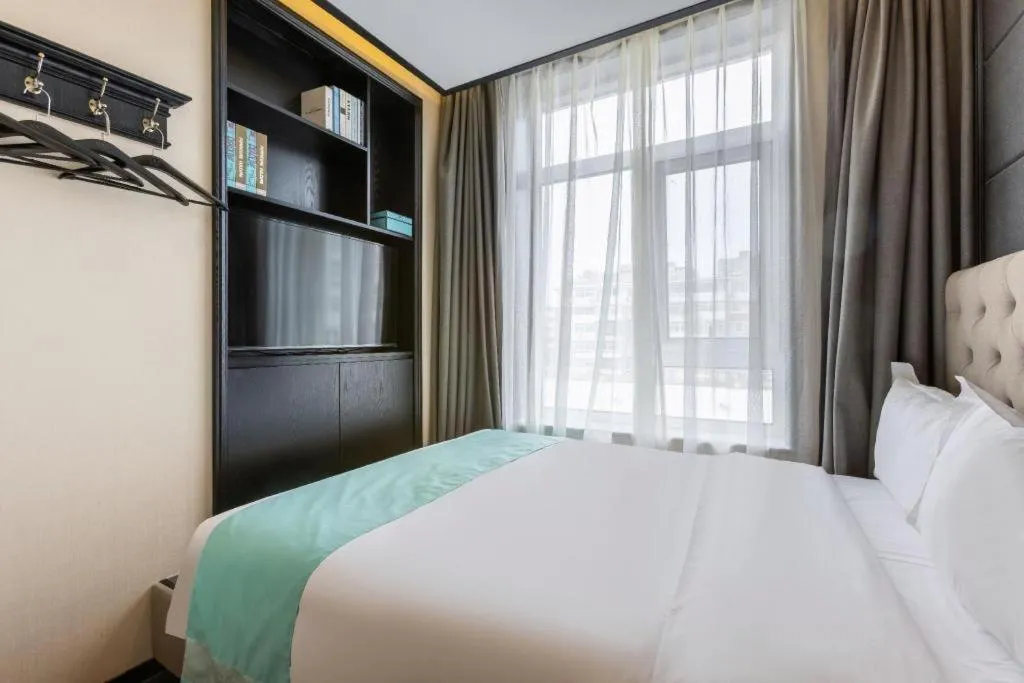 Bed in Xana Hotelle Beijing Fengtai Railway Station Tiantan Hospital