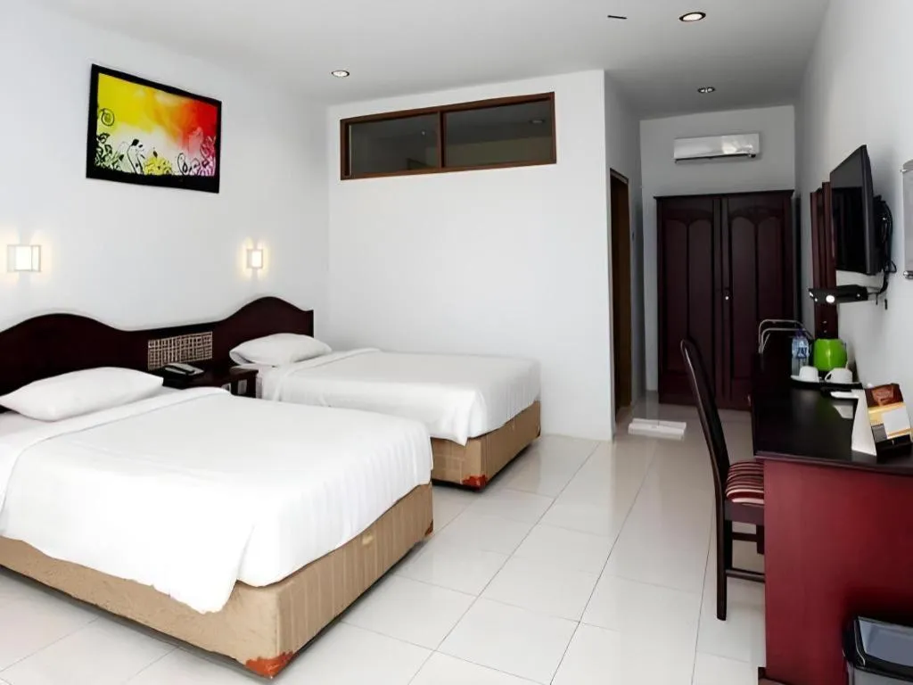 Bed in Toba Beach Hotel