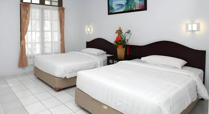 Bed in Toba Beach Hotel