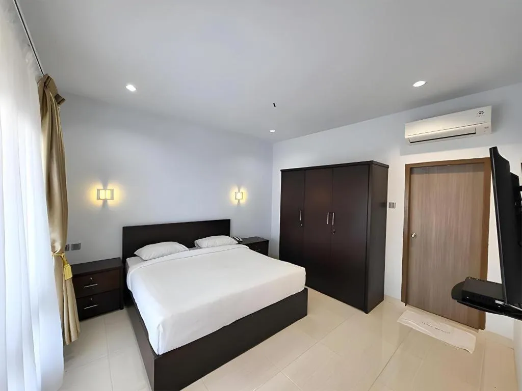 Bed in Toba Beach Hotel