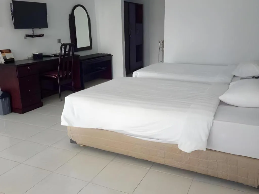 Bed in Toba Beach Hotel