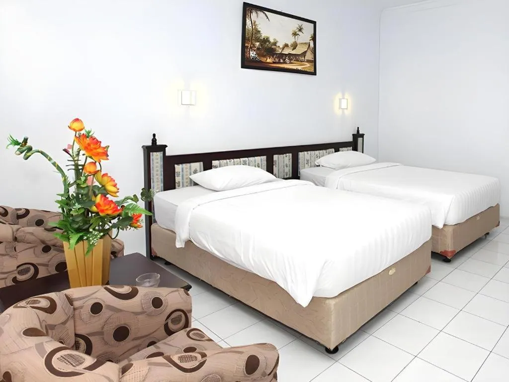 Bed in Toba Beach Hotel