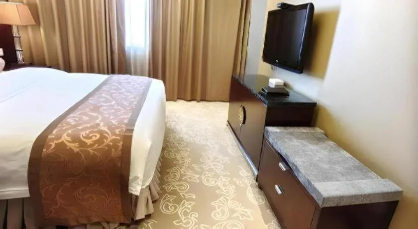 Bed in Xian Grand Soluxe International Hotel