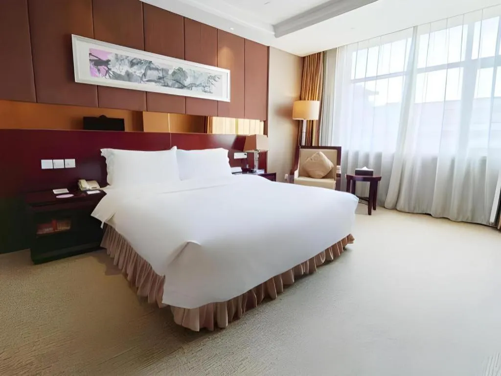 Bed in Xian Grand Soluxe International Hotel