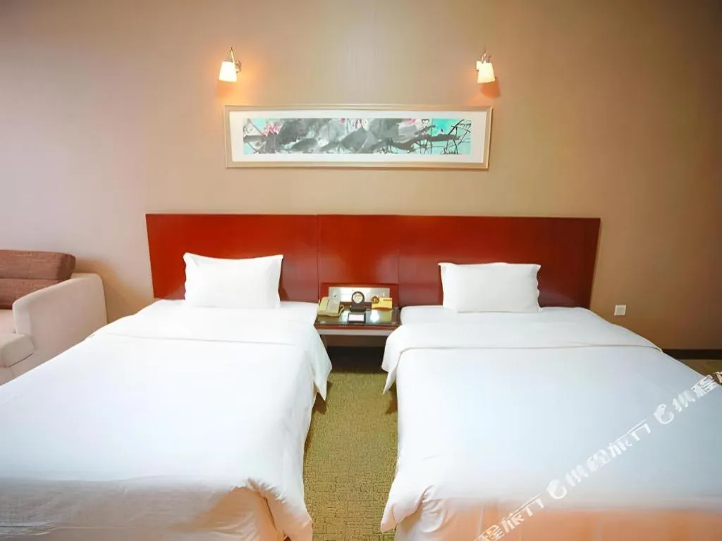 Bed in Xian Grand Soluxe International Hotel