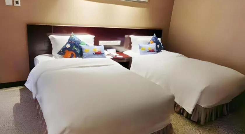 Bed in Xian Grand Soluxe International Hotel