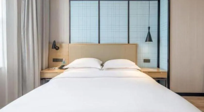 Bed in Echarm Hotel Baise Sports Center Dream Island Plaza