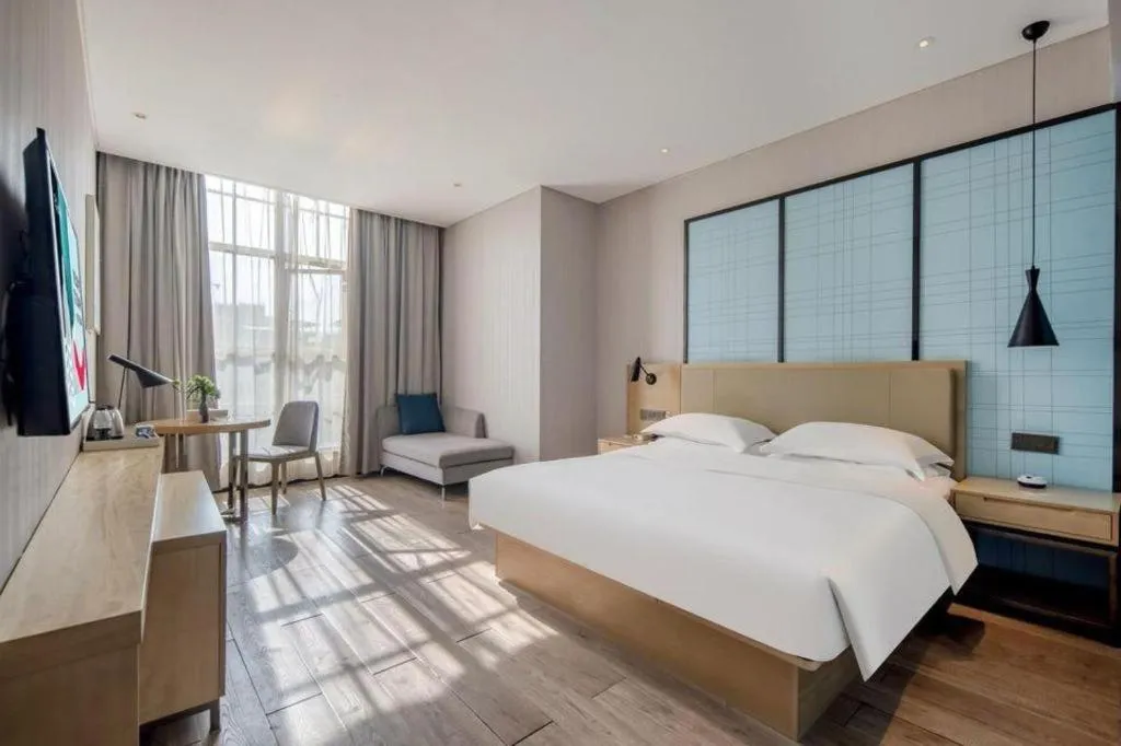 Bed in Echarm Hotel Baise Sports Center Dream Island Plaza